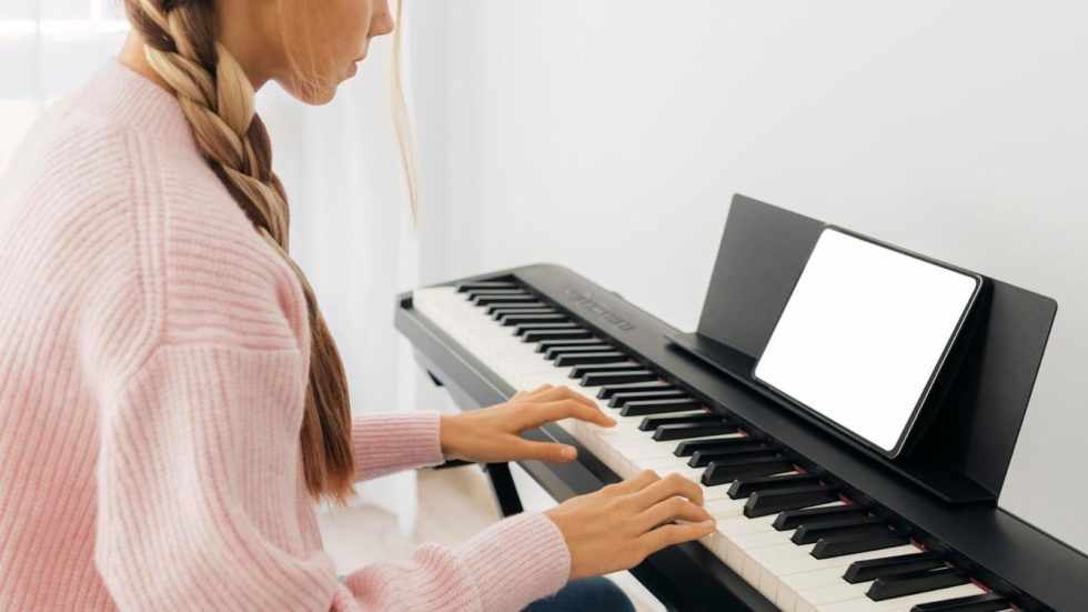 a girl playing musical keyboard